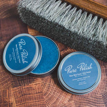 Load image into Gallery viewer, Navy Blue Shoe Polish Paste Wax open tin next to a horsehair brush