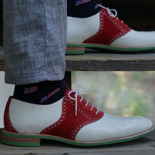 Load image into Gallery viewer, White leather pebble grain saddle shoes worn with grey slacks and American flag socks