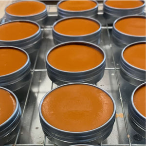 Light Brown Shoe Polish Paste/Wax tins cooling on a rack after being freshly poured