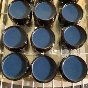 Fresh batch of Navy Blue Leather Cream Polish on a cooling rack