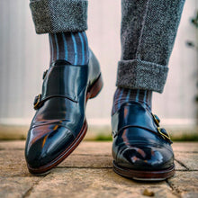 Load image into Gallery viewer, Shellvedge wears a pair of navy blue double monk strap loafer shoes shined with Pure Polish