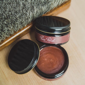 Walnut Leather Cream Polish open jar next to a horsehair brush